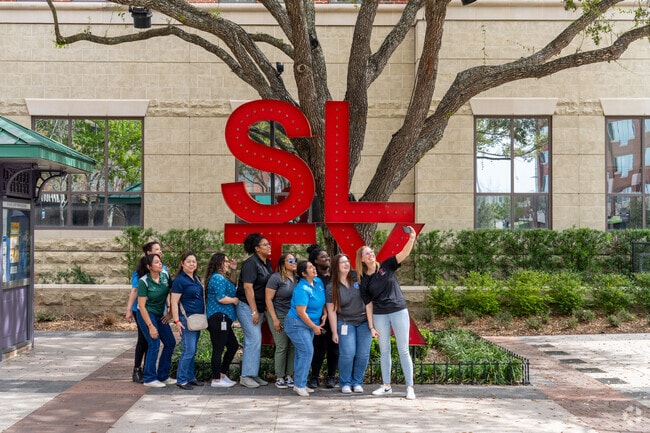 A joyful moment as the women of the Sugar Land Court snap a group selfie.