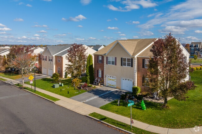 Townhomes with stucco and brick built in early 2000s are great buys in Lower Macungie West.