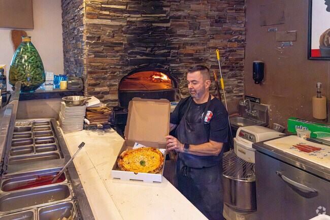 Enjoy a delicious coal-fired pizza from Zona Blu in Bonaventure.