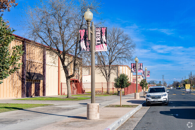 Several banners hang from classic street lights in front of Tulare Union High School.