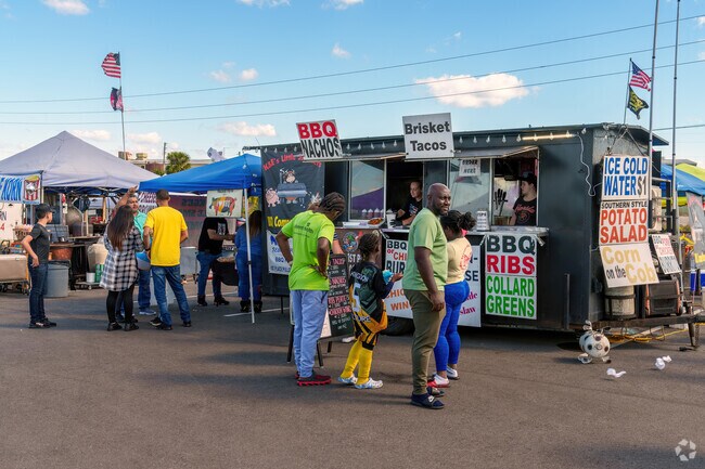 Davenport residents line up for brisket tacos at the Community BBQ Event.