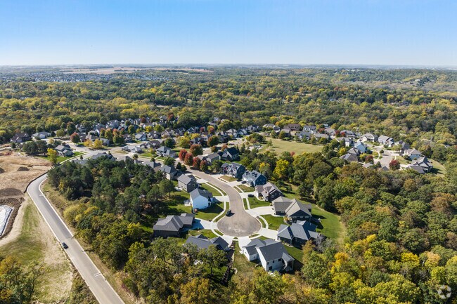 Pine Ridge offers a serene, wooded setting with spacious homes and scenic cul-de-sacs.