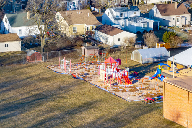 A recreation area behind St Stephen Lutheran School features play structures for students.