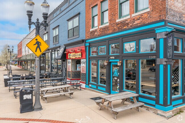Storefront shops and cozy restaurants located on S Washington Avenue, just outside of the Fabulous Acres neighborhood