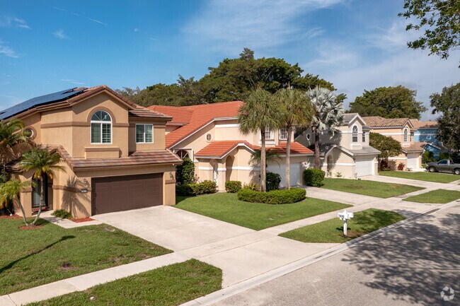 Spanish style homes are common in the Lake Charleston neighborhood of Green Acres, FL.