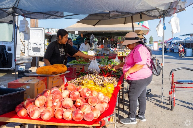 A shopper selects fresh produce at the Madera Flea Market in North Madera.