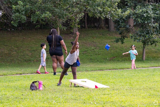 Youth play corn hole games at the Hyde Park Youth Day.