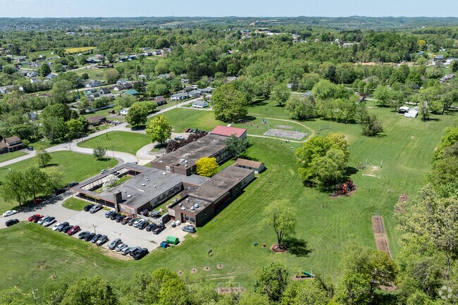 Marshall Elementary School is surrounded by single family homes and many trees.