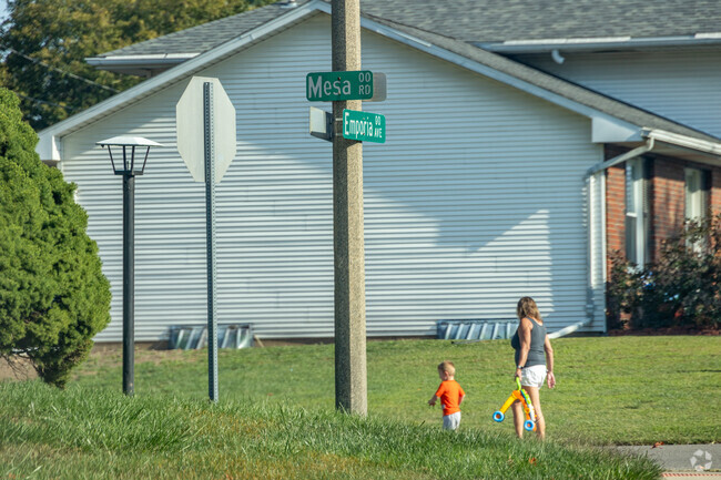 The neighborhood's sidewalk-lined streets connect directly with the Sangamon Valley Trail.