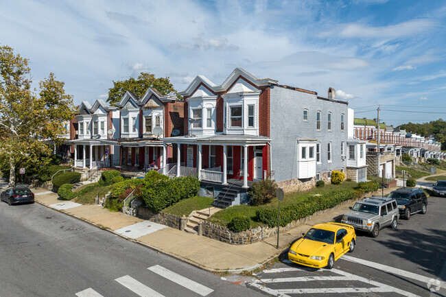 Traditional Baltimore brick rowhomes in Winchester have small porches and range in upkeep.