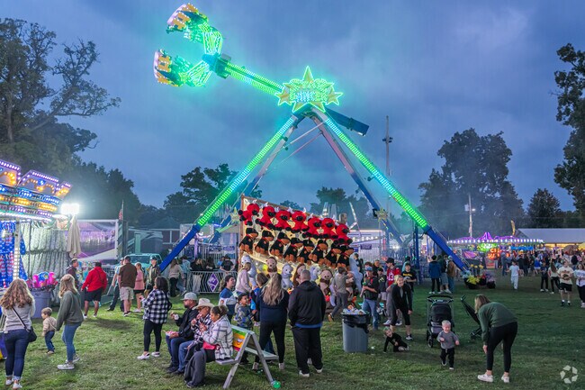 Thrill rides draw crowds at the Sandwich Fair, established in 1888.