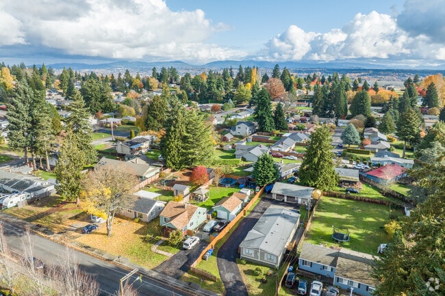 An overview of the SeaTac community shows homes with large lots and surrounded by nature.