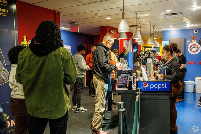 Movie-goers buy snacks at The Neon near Webster Station,