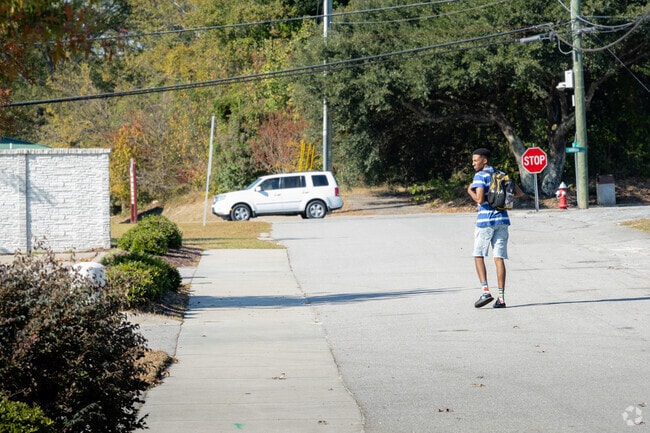 Pedestrians enjoy taking a walk along neighborhood roads in Burton Heights.
