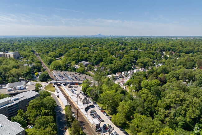 Live peacefully surrounded by trees in the quiet neighborhood of Wyncote.