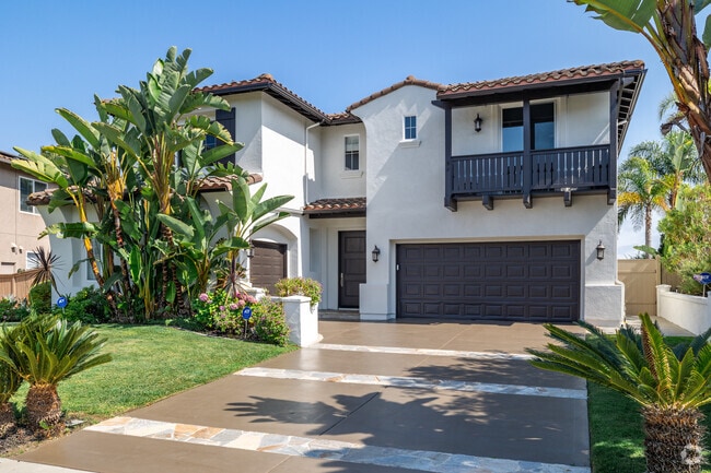 A two-story Spanish home in Aviara features ample garage space.
