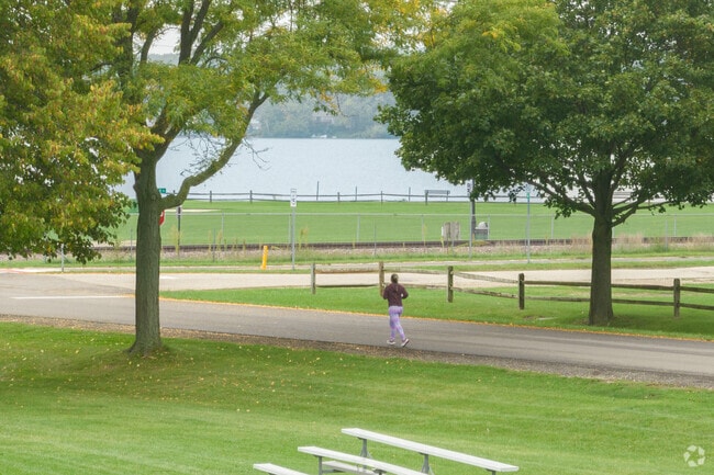 A local resident of Mccullom Lake jogs through Peterson Park.