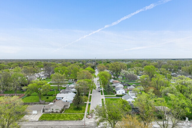 Homes in Dyer have big green yards filled with trees.