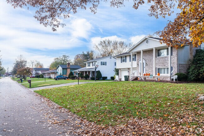 Many two-story homes in Martindale Park have covered front porches with tall columns.