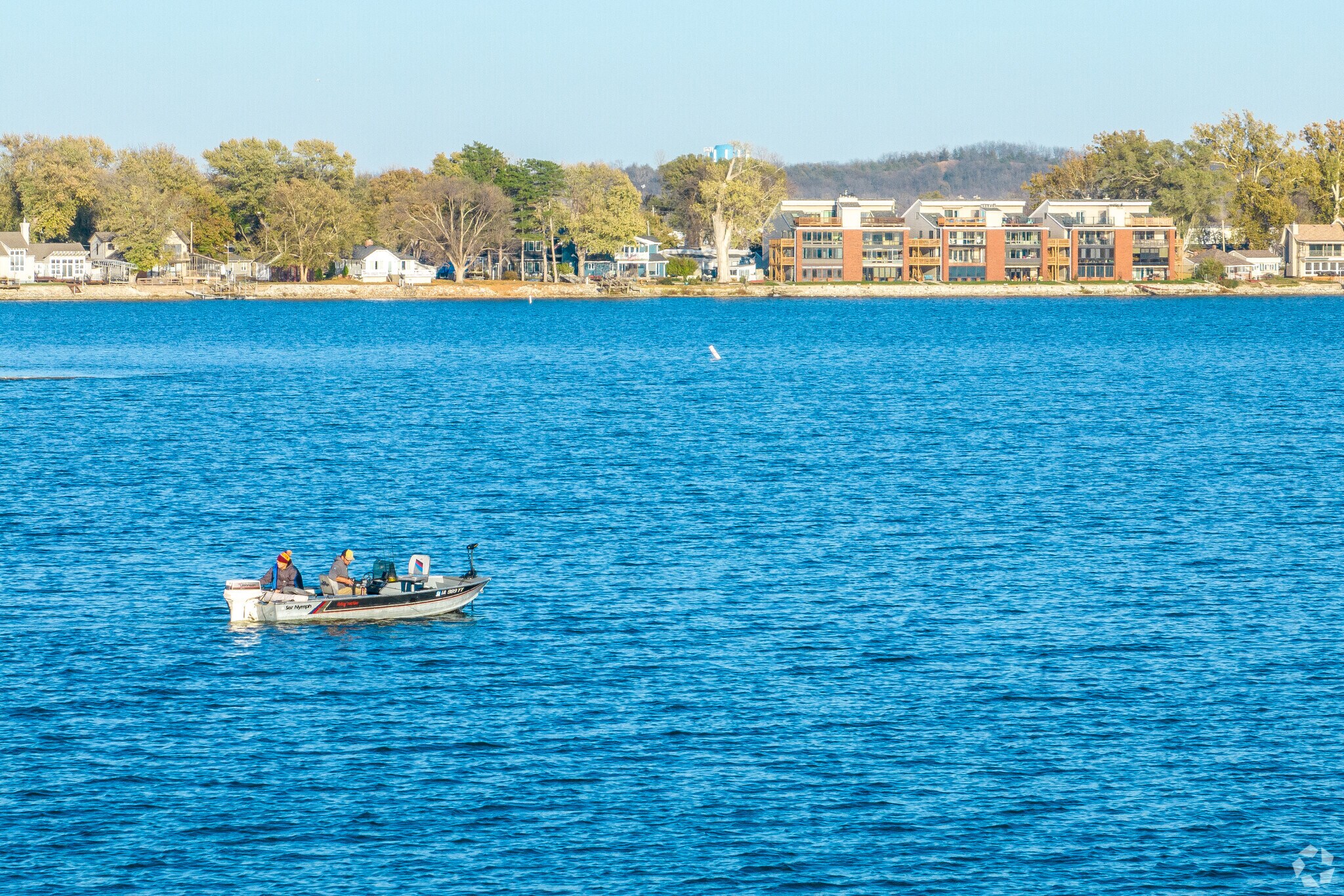 Visitors paddle board and kayak on the man-made Lake Manawa's waters