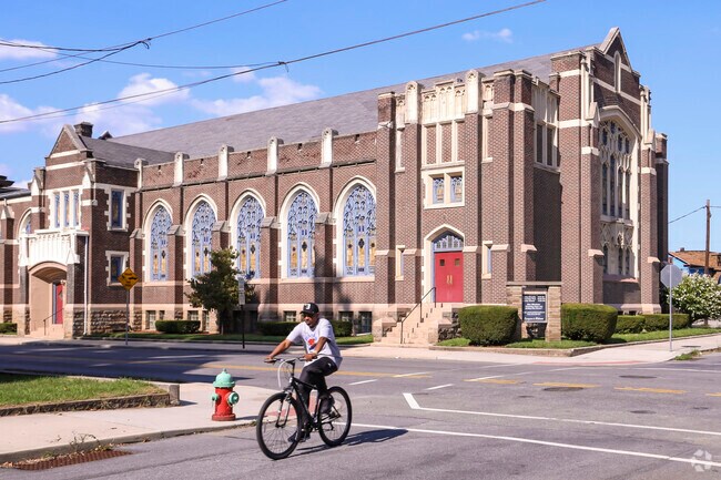 A man rides his bike past one of the many historic churches in the area in Kernville.