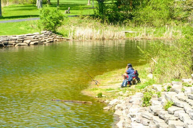 Resident fishing at one of the five lakes located in Pratt's Wayne Woods.