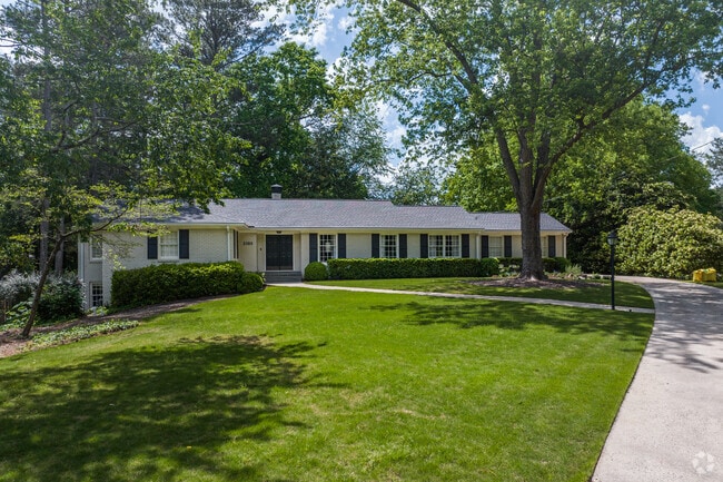 Classic ranch-style homes with long front lawns represent the spacious and elegant residential style that defines Margaret Mitchell.