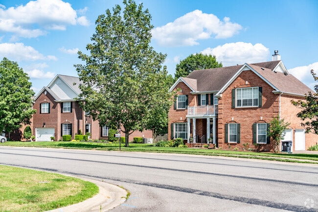 Traditional two-story brick homes line Traceside streets in Nashville.