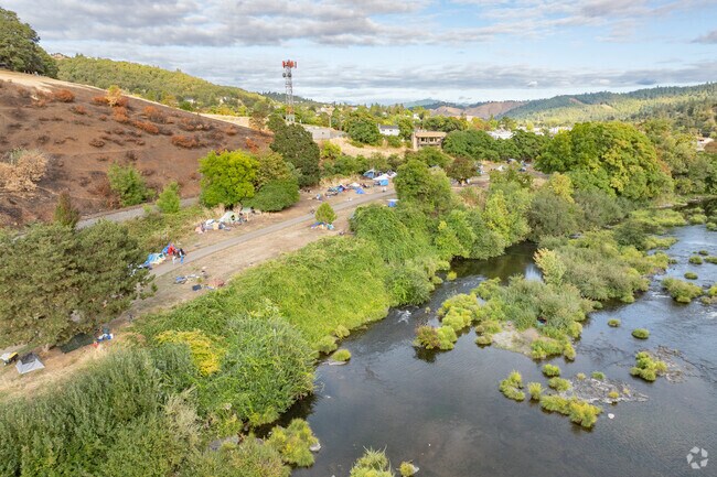 A homeless camp is established across the river from Laurelwood to help the community.