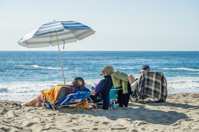 Portafina residents can access Victoria Beach and enjoy the warm sun and sand.