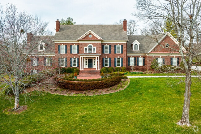 This is an example of a Colonial Revival classic box style home in Anchorage.