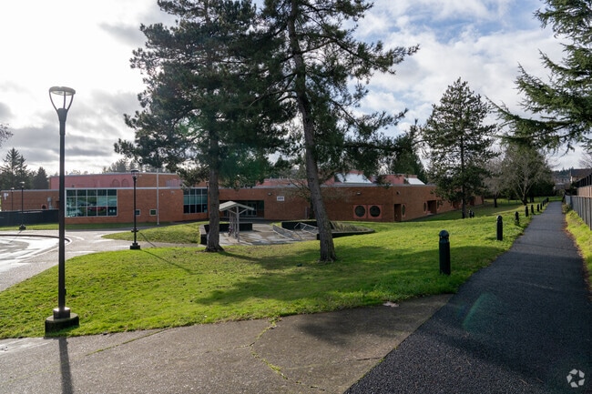 A walking path curves along the campus.