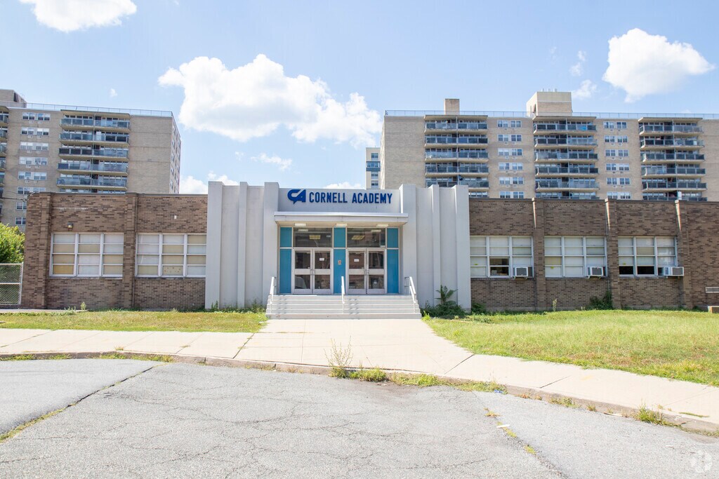 A head-on shot that shows the main section of the building with the name