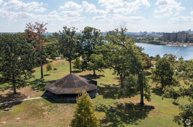 Druid Hill Park includes a lakeside pavilion surrounded by trees.