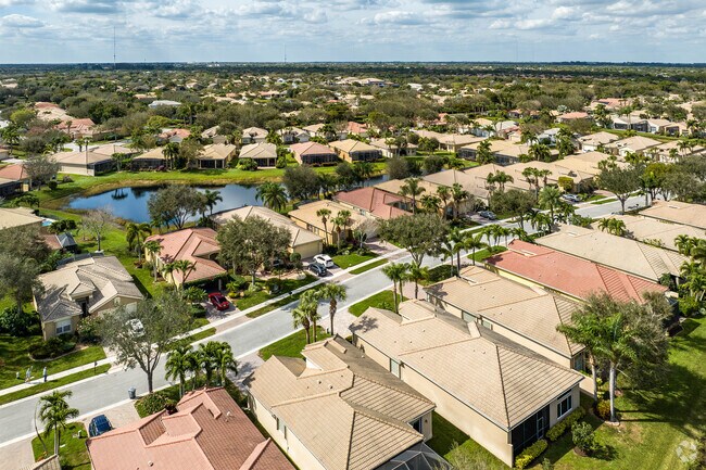 Spanish revival homes in Valencia Pointe are beautifully maintained along the lake.