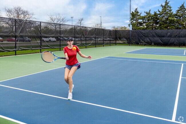 An athlete returns a shot on the public courts at the Warren Township Center in Gurnee.