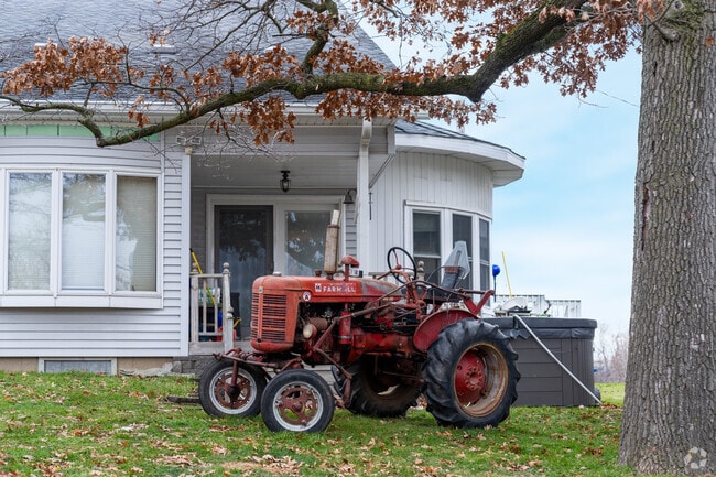 An old tractor sits in the front yard in Paddock Lake.