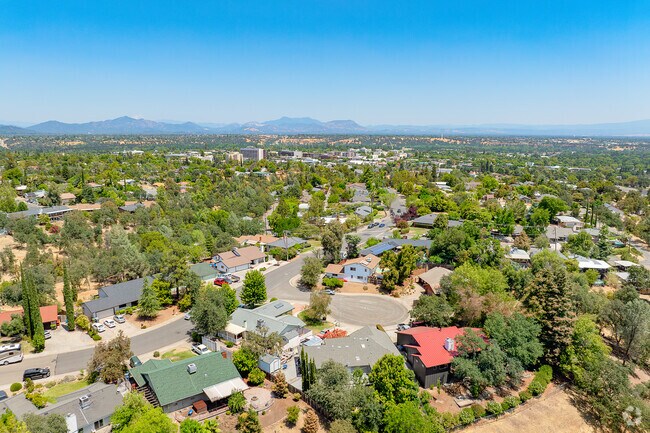 Row of Greenwood homes in cul-da-sac sit peacefully with views of Downtown Redding.