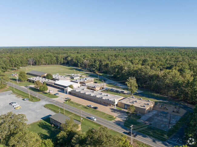 Benton Elementary Schools is nestled in a thick patch of trees.