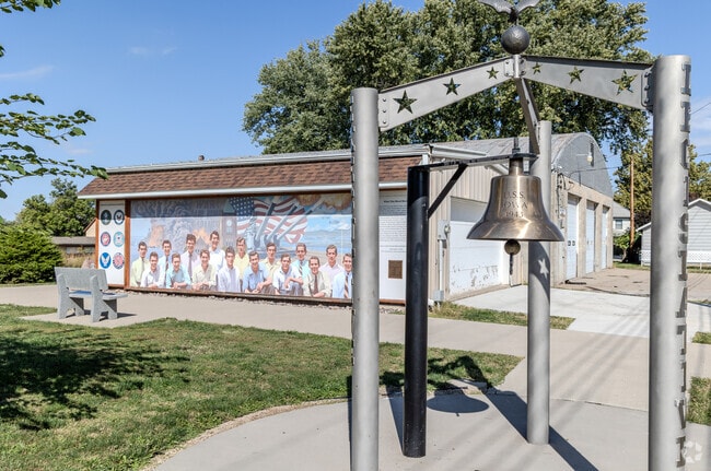 The mural and bell honor veterans at Lucas County Veterans Memorial Park.