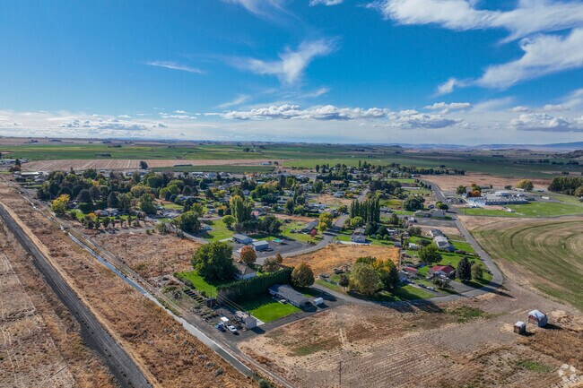 Aerial views of Basin City reveal a blend of farmland and close-knit homes.