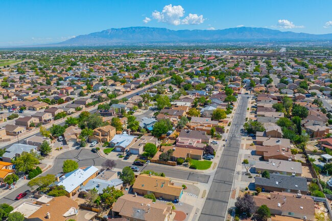 Tree‑lined streets in S.R. Marmon showcase tidy Southwestern homes.