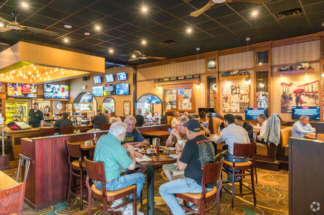 Friends and family gather for great food and atmosphere at Gilligan's Bar & Grill in Enhaut.