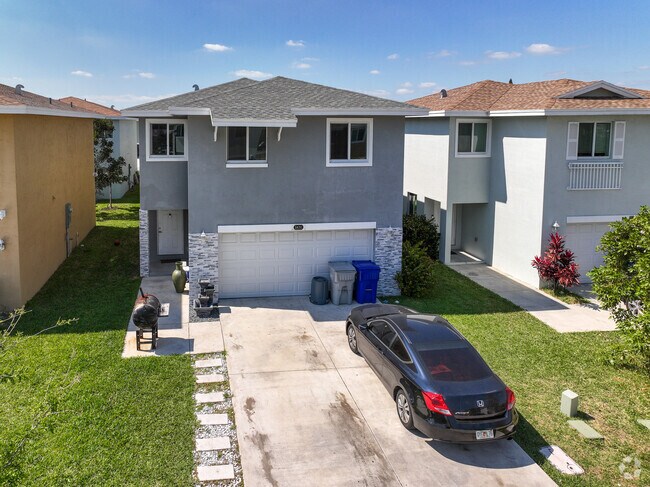 Row of two-story homes in Blanche Ely.