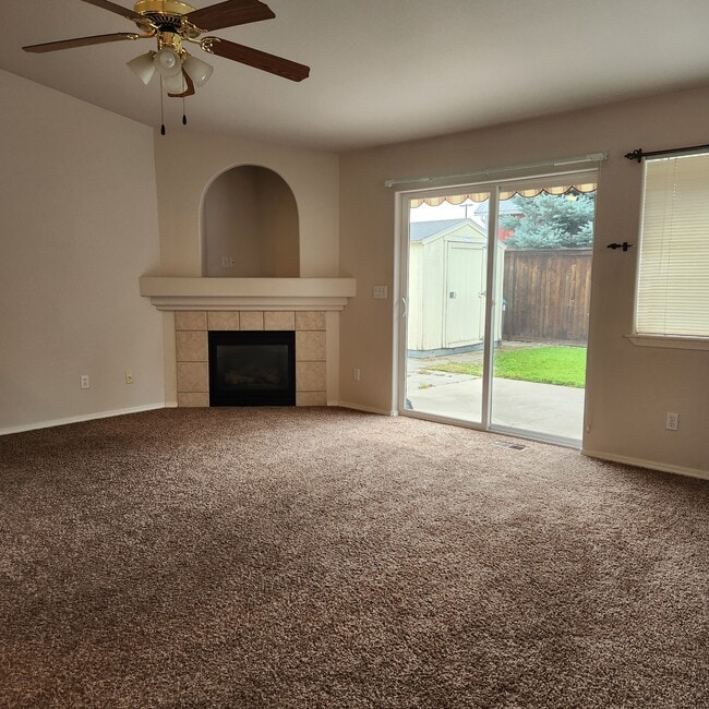 Spacious living room with gas fireplace.