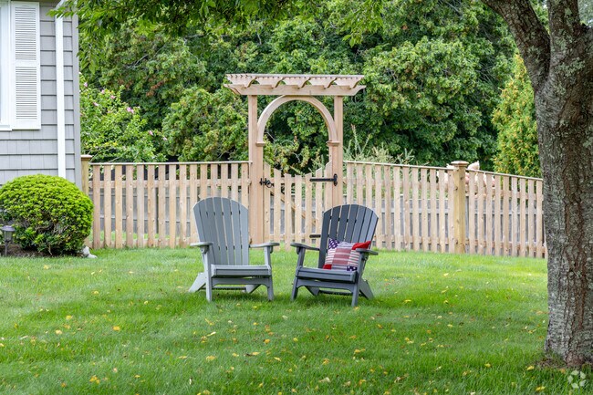 Calm quiet lawns in the Lily-Almy Pond neighborhood are typical of what you will find here.