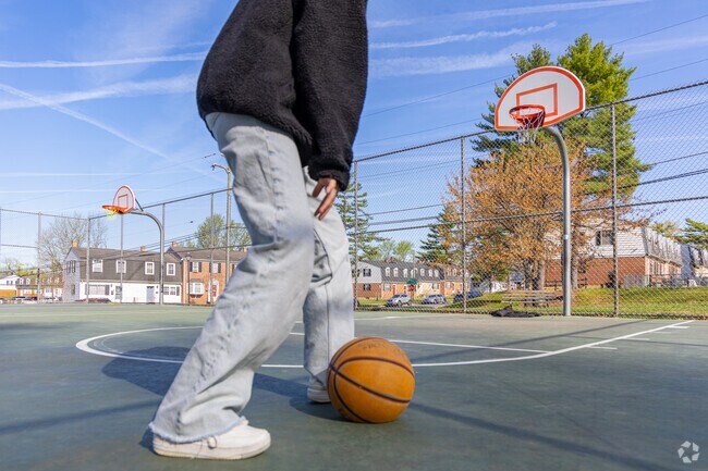 Perfect your jump shot on one of the paved basketball courts in Garden Village Park in Cedonia.