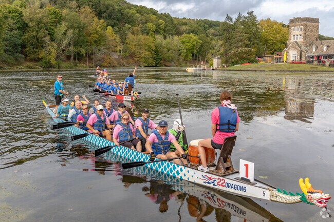 A boat celebrating their win at the Pittsburgh Dragon Boat Festival.