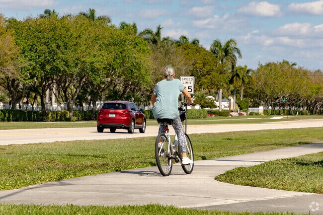 Folks in the Indian Spring neighborhood of Golf, FL get around on bike or in cars.