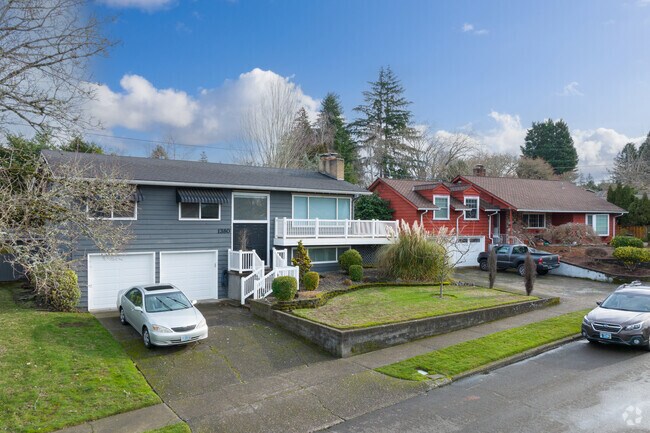 The average streetscape is flanked by deep-green front lawns, dozens of trees, spacious driveways and ranch-style homes of midcentury construction.